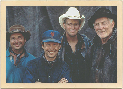 The cast of City Slickers II: Left to right: Jon Lovitz, Billy Crystal, Daniel Stern, and Jack Palance.