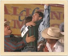 Lane Frost (Luke Perry) celebrates a win during one of the many rodeo scenes in “8 Seconds.”