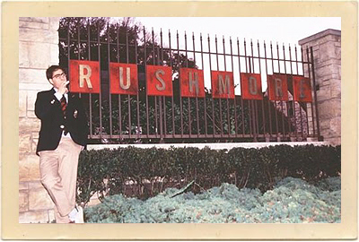 Jason Schwartzman stands by the “Rushmore sign” that was created for this high school location in Houston for the 1998 independent Wes Anderson film “Rushmore.”