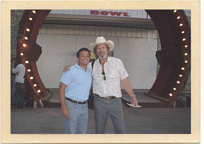 Jeff Bridges poses with the Mayor of Espanola, Joseph Maestas, in front of the “Spare Room” location outside Espanola, New Mexico.